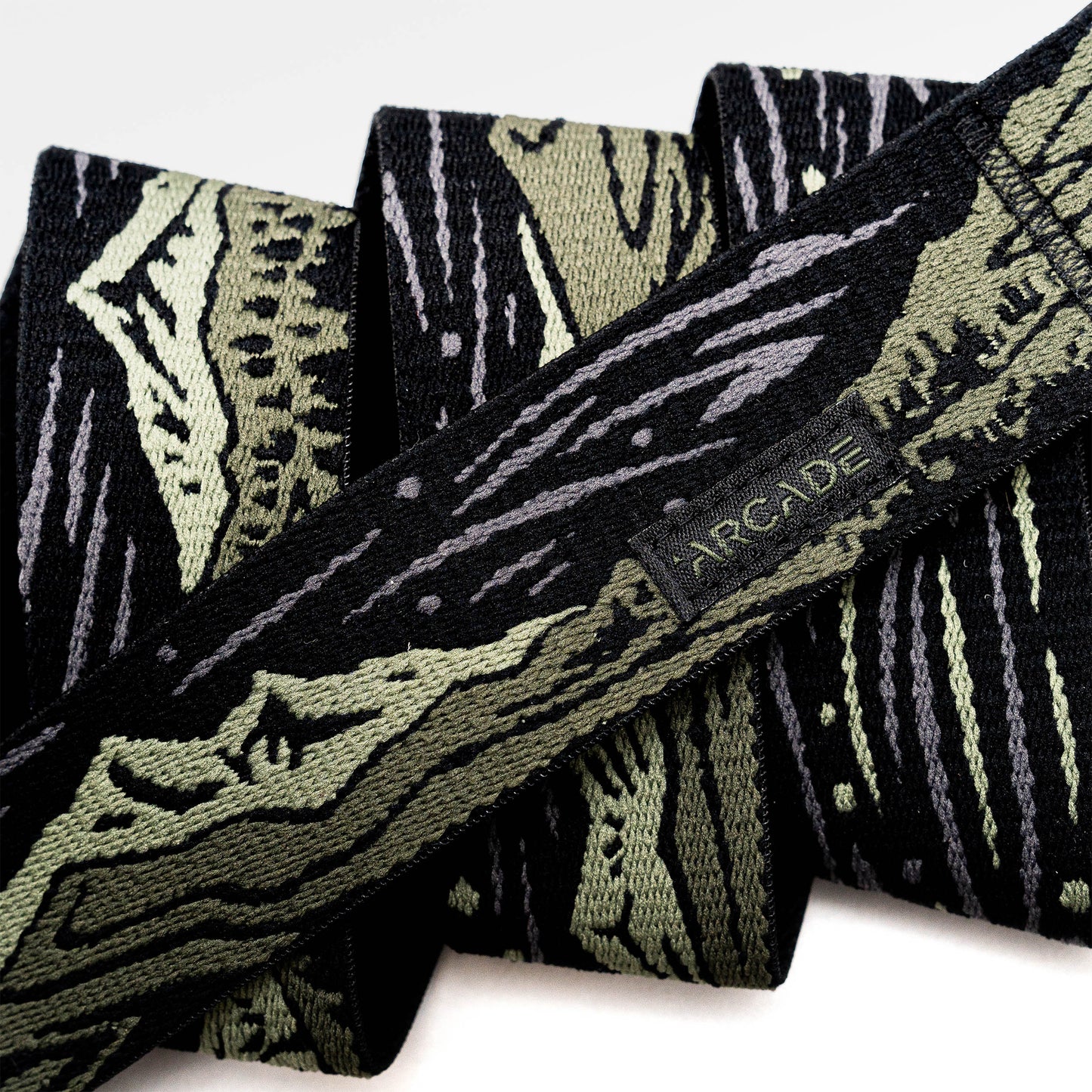 Arcade Out of Range Belt in Ivy Green — webbing texture close-up
